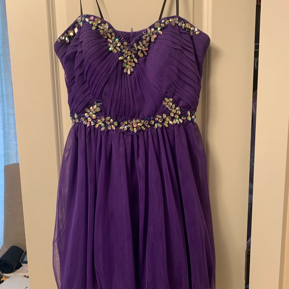 Purple homecoming/prom dress. Only worn once. size 13/14 but fits like 10/12